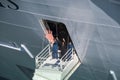 Crew Members Waving from Cruise Ship