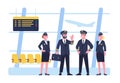 Crew pilots and stewardesses stand in airport building. Airplane captain and attendants in waiting hall. Airline staff Royalty Free Stock Photo