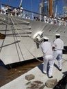 Crew releasing mooring ropes