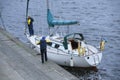 Crew of sailing yacht yachtsmen moor to a berth using ropes