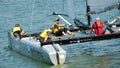 Crew of SAP Extreme Sailing Team steering boat at Extreme Sailing Series Singapore 2013