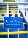 Crew only sign on a ship in front of the stairs to the bridge Royalty Free Stock Photo