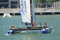 Crew of Team Aberdeen Singapore steering boat at Extreme Sailing Series Singapore 2013