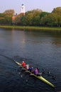 A crew team plies the Charles River