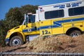 A crew transport truck from Ventura County Fire Department arrives at the scene of a brush fire