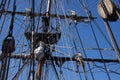 Crew unfurls a sail on a yardarm