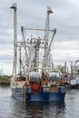 Crewmen watching as commercial fishing boat U-Boys gets ready to dock