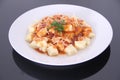 Gnocchi with tomatoe sauce parmesan isolated black background Sao Paulo Brazil Royalty Free Stock Photo