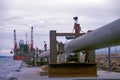 Crib Point Victoria dock loading pipeline onto the Apache Boat.