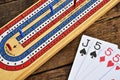 Cribbage board and playing cards Royalty Free Stock Photo