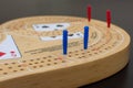 Cribbage card game and board up close looking at the blue and red pegs Royalty Free Stock Photo
