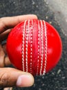 A cricket ball is a hard, solid ball used to play cricket Royalty Free Stock Photo