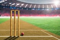 Cricket Leather Ball and Wickets in Stadium With Copy Space Royalty Free Stock Photo