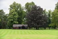 Cricket pitch and wooden pavillion building Royalty Free Stock Photo