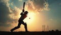 Cricket Player Batting at Sunset Royalty Free Stock Photo