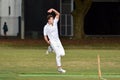 Cricket player bowler reaches his delivery stride Royalty Free Stock Photo