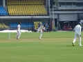 Cricket Player Funny Dancing Pose. Royalty Free Stock Photo