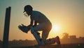 Cricket Player Kneeling at Sunset Royalty Free Stock Photo