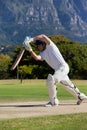 Cricket player playing on field during sunny day