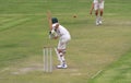 Cricket school boy is attacking the ball Royalty Free Stock Photo