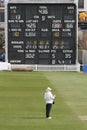Cricket umpire and scoreboard Royalty Free Stock Photo