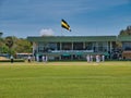 Cricketers and buildings at Galle International Stadium in Galle in southern Sri Lanka. Taken on a sunny day