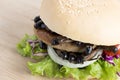 Crickets insect for eating as food items in bread burger made of fried insect meat with vegetable on wooden table it is good