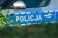 Crime, accident or strike concept. Polish police markings on the car. Police polish =