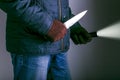 Crime concepts robbery concepts a robber aimed his sharp knife. Royalty Free Stock Photo