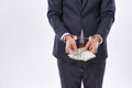 Crime doesnt pay. Cropped studio shot of a businessman in handcuffs holding American Dollars.