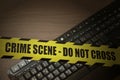 Computer keyboard with crime scene tape