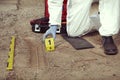 Technician Criminologist preparing tire print left in dust of field way for documentation