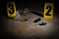 Crime scene markers and evidences on grey stone table Royalty Free Stock Photo