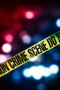 Crime scene tape with red and blue lights Royalty Free Stock Photo
