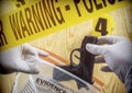 Crime scene for weapon, Police Scientific manipulating bag of evidence, conceptual image