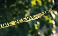 Crime scene yellow police tape closeup Royalty Free Stock Photo