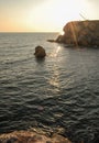 Crimea, Atlesh, silhouette of a crane fishermen on a cape in the rays of the setting sun Royalty Free Stock Photo