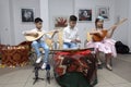 Crimean Tartar boys and girl in a native costumes playing music during traditional wedding