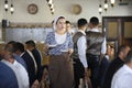 At the Crimean Tartar restaurant: waitress in Tartar native dress setting the table