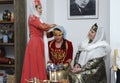 Crimean Tartar traditional wedding ceremony: bridesmaids preparing bride to meet groom