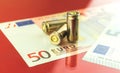 Criminal Europe and bloody dirty money concept background with bullet and Euro banknotes Royalty Free Stock Photo