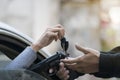 Criminal with gun robbing woman in car Royalty Free Stock Photo