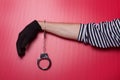 Criminal hand locked in handcuffs Royalty Free Stock Photo