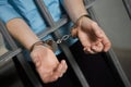 Criminal Handcuffed To Bars Royalty Free Stock Photo