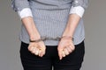 Criminal hands locked in handcuffs. Close-up view Royalty Free Stock Photo