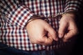 Criminal hands locked in handcuffs Royalty Free Stock Photo