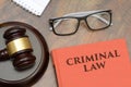 Criminal Law sign with wooden gavel and red book