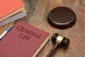 Criminal Law sign with wooden gavel and red book