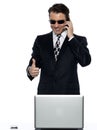 Criminal man computer hacker satisfied happy Royalty Free Stock Photo