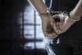 Criminal wearing handcuffs in prison Royalty Free Stock Photo